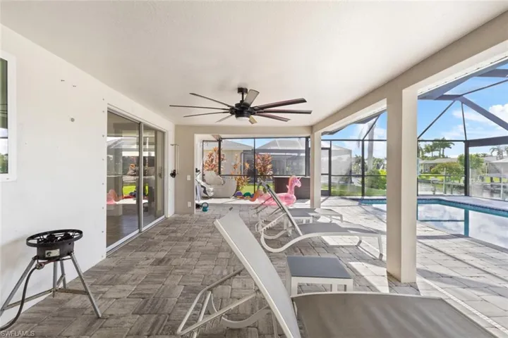 Sunroom / solarium featuring plenty of natural light and a ceiling fan