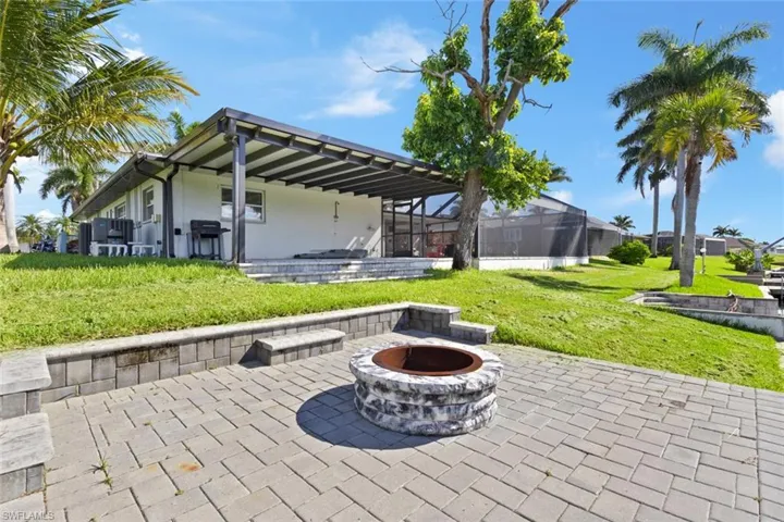 View of patio / terrace with an outdoor fire pit