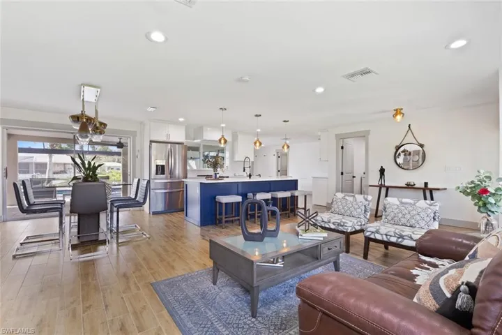 Living room featuring light wood-style floors and recessed lighting