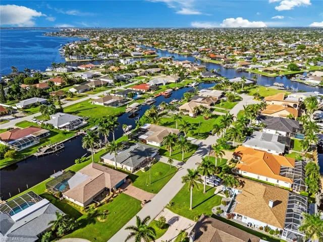 Aerial view of residential area featuring a large body of water