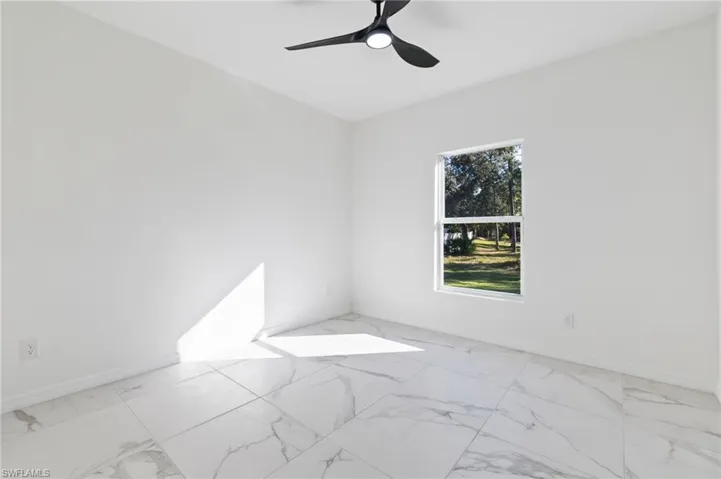 Spare room featuring ceiling fan