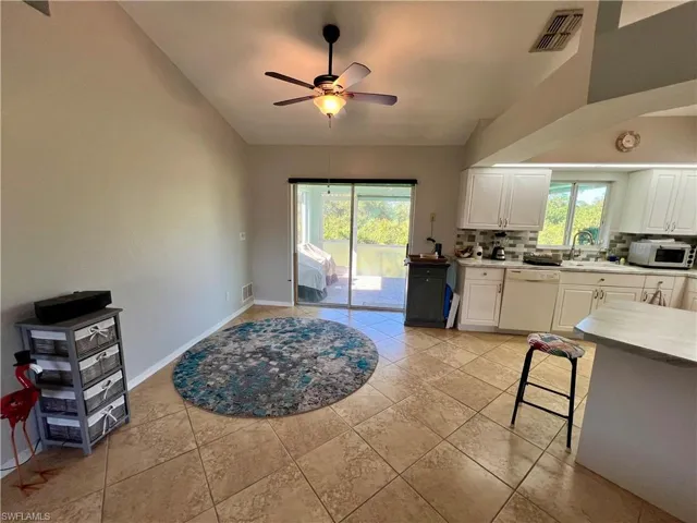 dining area with tiled floors.