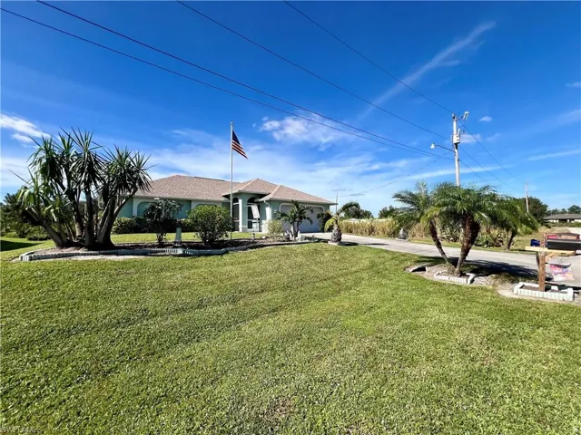 View of front of property with a front lawn