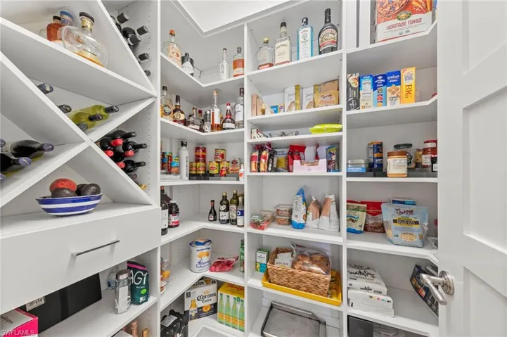 Custom California Closet organizers in the walk-in pantry.