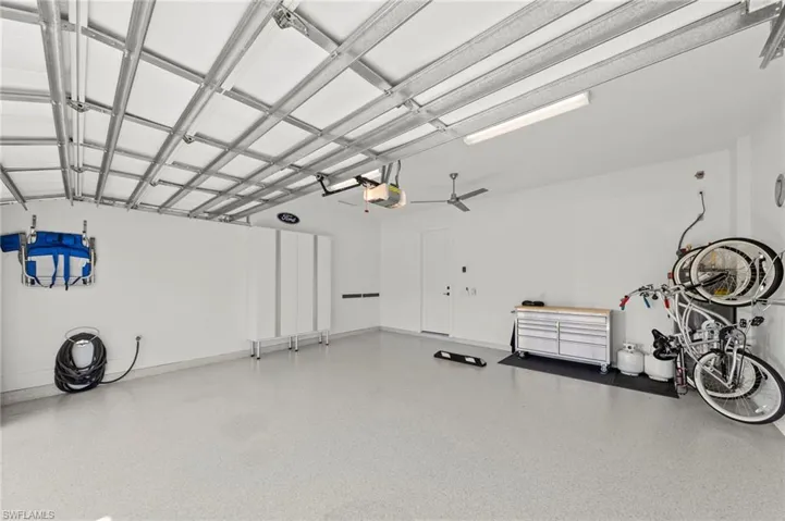 Current bunk room can be converted back to a THIRD GARAGE BAY. Garage with a garage door opener New CEILING FAN (November 2018), New HEAVY DUTY EPOXY FLOOR (January 2019), New OVERHEAD DOOR & GARAGE ATTIC INSULATION (January 2019), New CUSTOM CALIFORNIA CLOSET STORAGE ORGANIZERS (February 2020), New HOT WATER RECIRCULATION PUMP (October 2022), New GARAGE INTERIOR PAINT (July 2023)