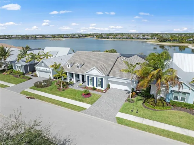 WELCOME HOME! This home is LOADED with CUSTOM FEATURES - 4 beds+den, 3.5 baths. 3097 livable square feet and 4333 total square feet in this OPEN FLOOR PLAN home on an UPGRADED WATERFRONT LOT on 125-acre Big Eagle Lake with irrigation system. The concrete block home has an oversized 2-car garage. Current bunk room can be converted back to a THIRD GARAGE BAY. CAMERA SECURITY SYSTEM (November 2018). New LANDSCAPING (December 2025)