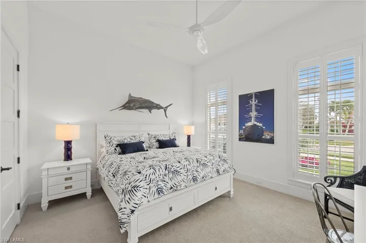 Bedroom featuring light carpet, ceiling fan, and lofted ceiling New CEILING FAN (November 2018)