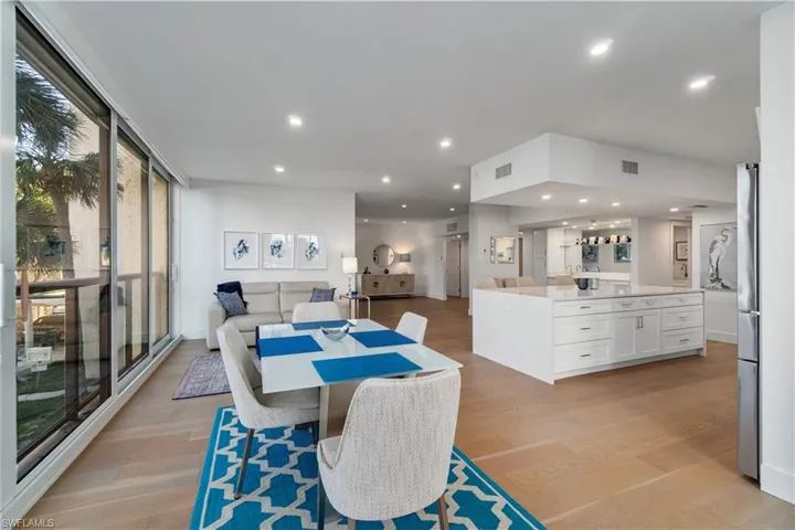 Dining room with recessed lighting and light wood-style floors