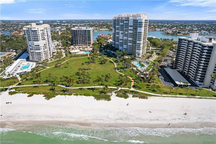 View of urban area featuring a nearby body of water and a pool