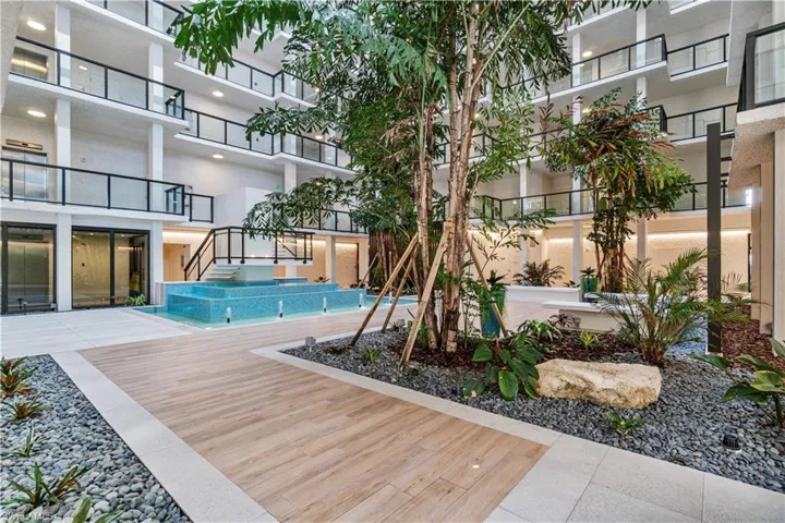 View of swimming pool with a patio and a balcony