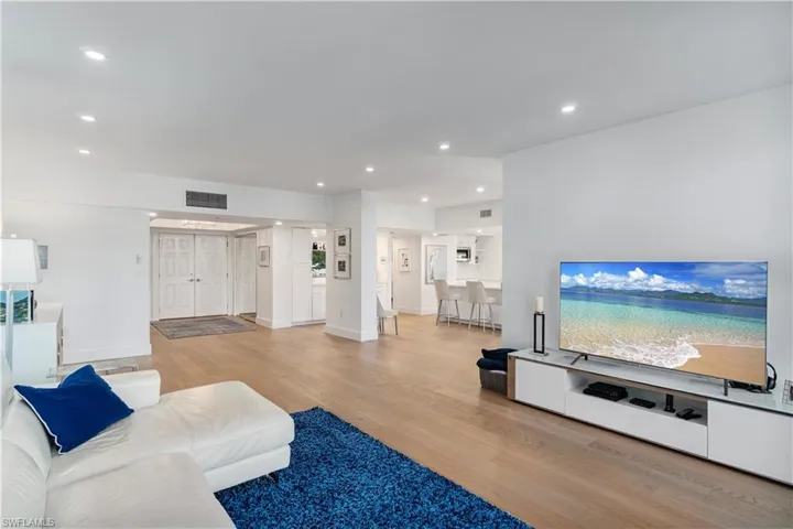 Living room featuring recessed lighting and light wood-type flooring