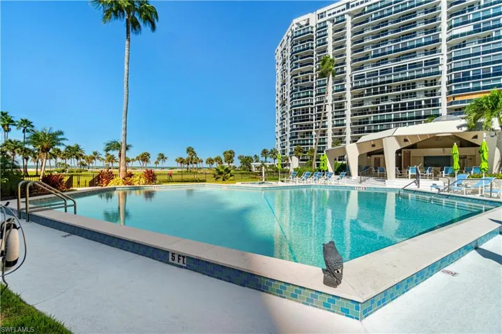 Community pool featuring a patio
