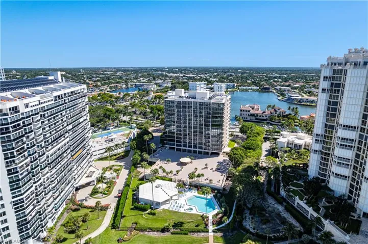 View of urban area featuring a pool area and a large body of water