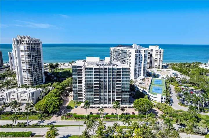 View of urban area with a large body of water and apartment complex / building