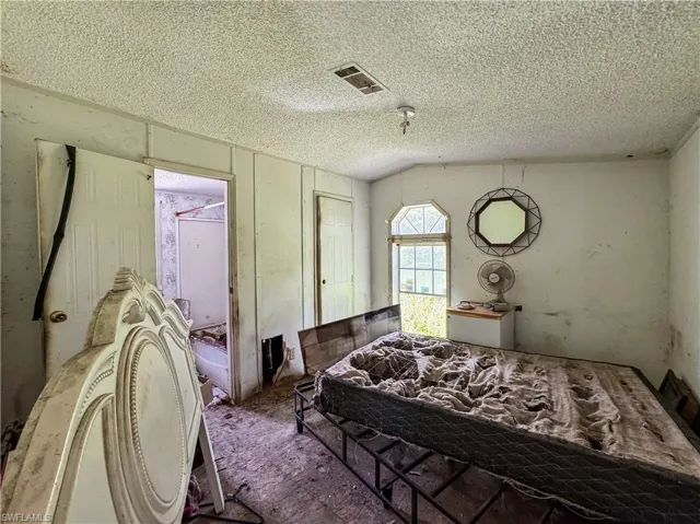 Bedroom featuring a textured ceiling