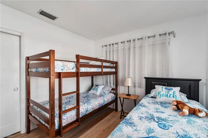 Bedroom with wood finished floors