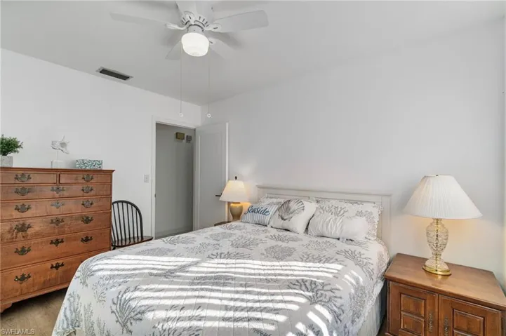 Bedroom with ceiling fan and wood finished floors