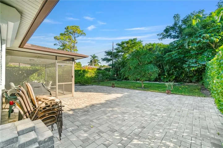 View of patio / terrace featuring a sunroom