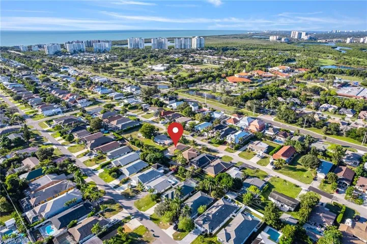 Aerial view of property's location featuring nearby suburban area