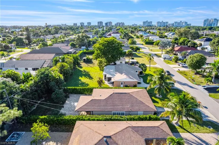 Aerial perspective of suburban area with city skyline