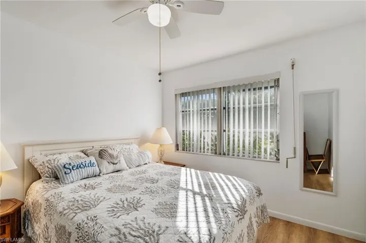 Bedroom with wood finished floors and a ceiling fan