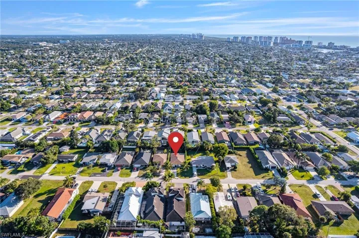 View of property location featuring city skyline and nearby suburban area