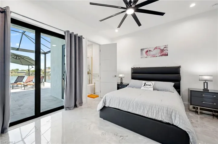 Bedroom with access to exterior, recessed lighting, ensuite bathroom, marble finish floor, and a ceiling fan