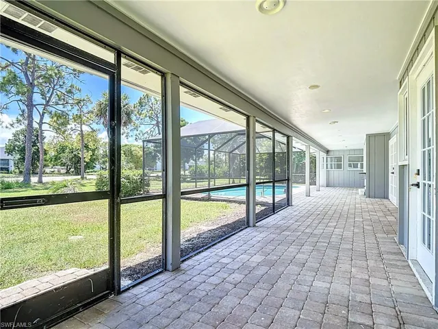 Unfurnished sunroom featuring plenty of natural light