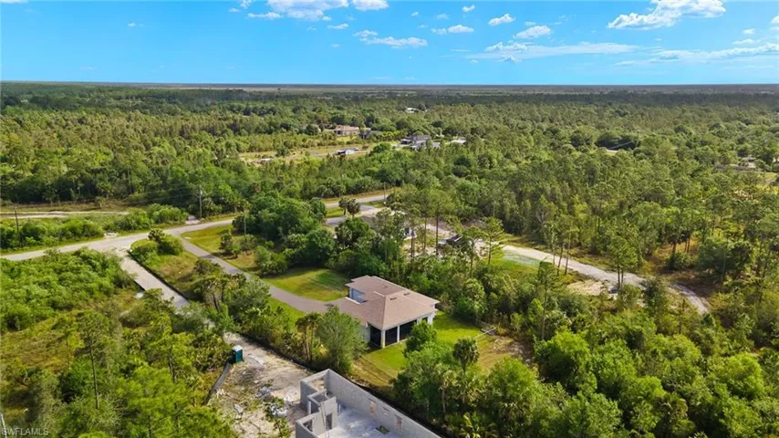 Bird's eye view with a wooded view