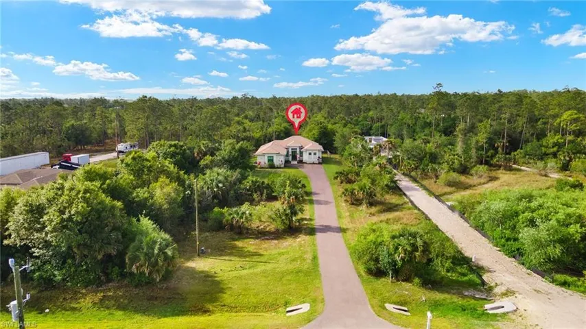 Aerial view featuring a view of trees
