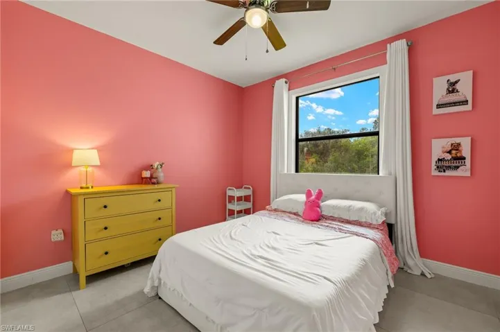 Bedroom featuring baseboards and a ceiling fan