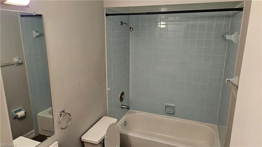 Bathroom with toilet and shower / tub combination