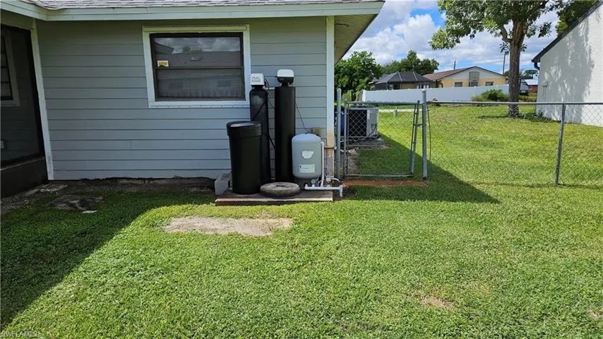 View of yard with a gate