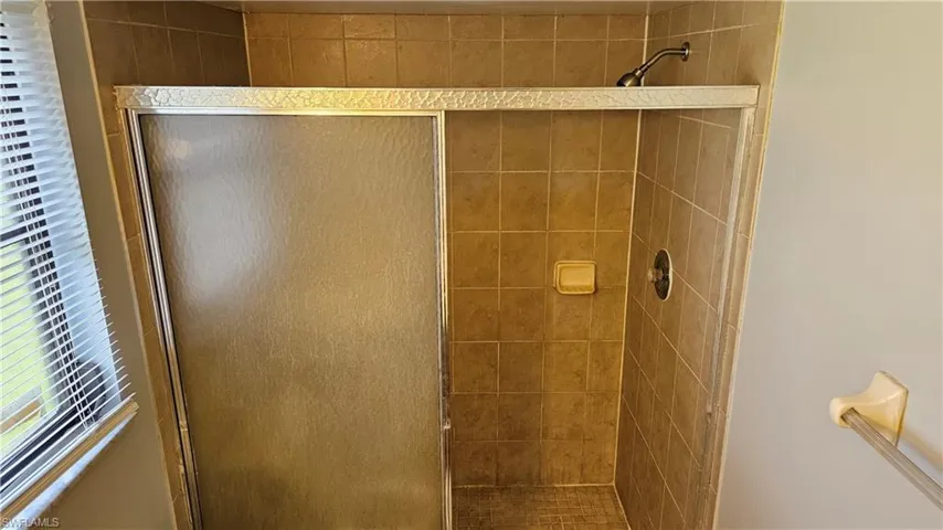 Bathroom featuring a shower stall