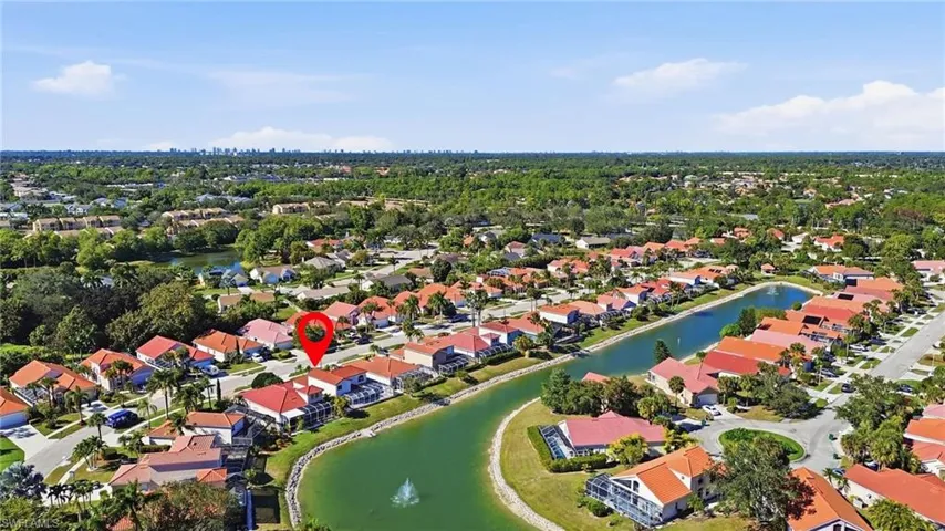 Aerial perspective of suburban area with a nearby body of water