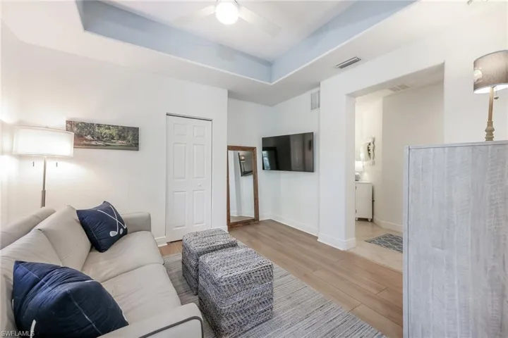 Den with a tray ceiling