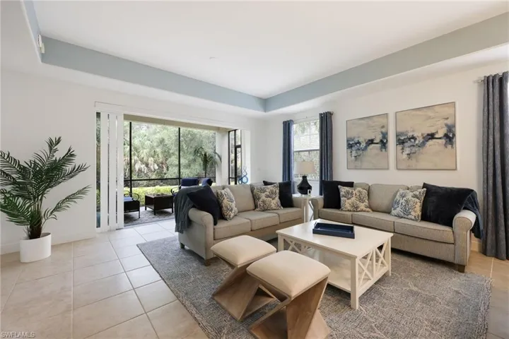 Tiled living room with a raised ceiling