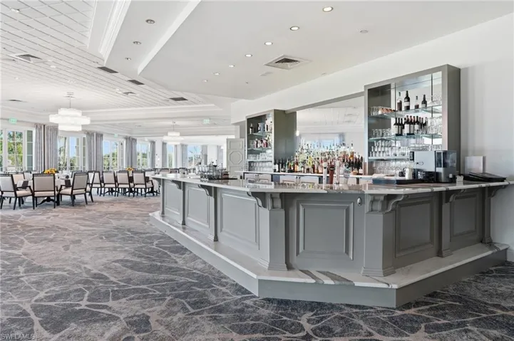 Bar with light stone countertops, at Golf Lodge