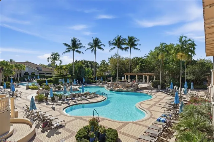 Community pool featuring a patio