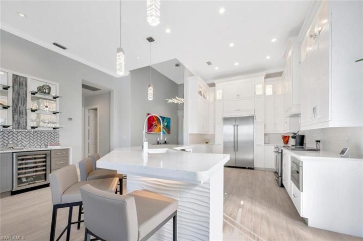Designer Pendant Lighting, Quartz Counter Tops and built in Microwave Drawer
