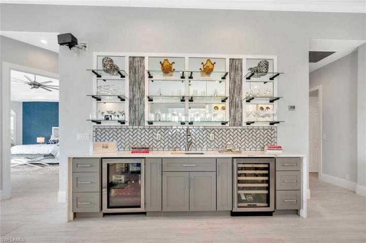 Built in Wet Bar with 2 beverage coolers ,glass shelving and plenty of cabinet space