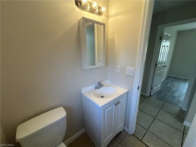 Bathroom featuring vanity and light tile patterned floors
