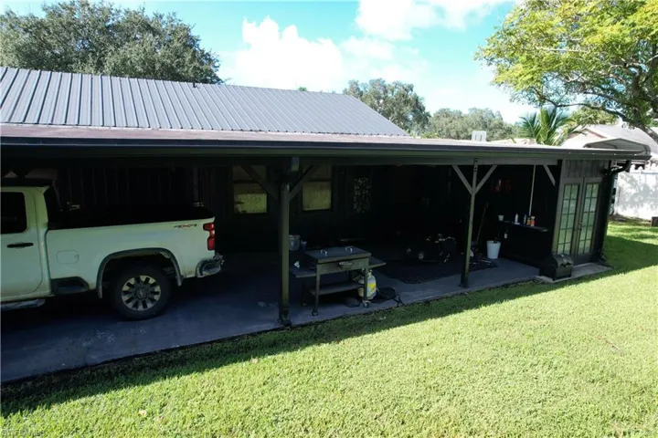 View of car parking with a lawn