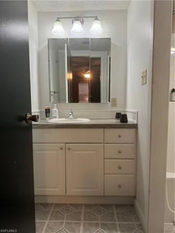 Bathroom with vanity and tile patterned floors