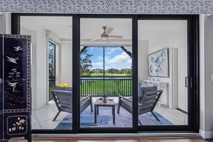 Dining area featuring ceiling fan, tile patterned flooring, and a water view