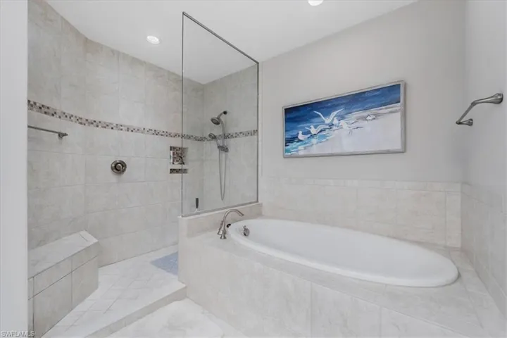 Full bathroom with a garden tub and a walk in shower