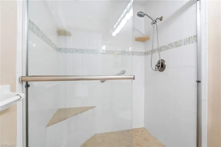 Bathroom featuring walk in shower