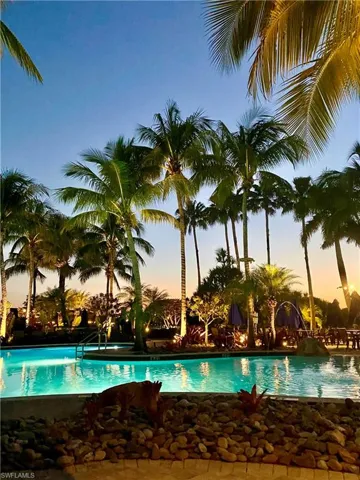 View of pool at dusk