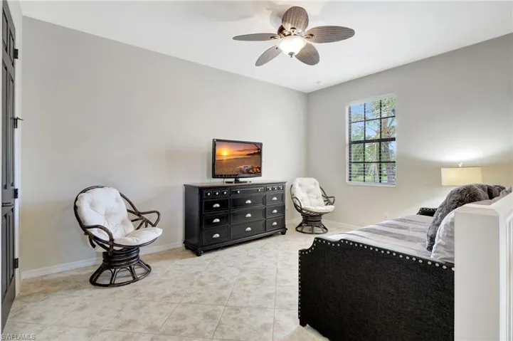 Tiled bedroom with ceiling fan