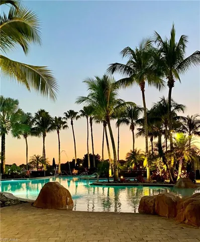 View of pool at dusk